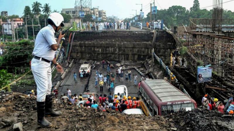 A section of over 50-year-old Majerhat Bridge on the arterial Diamond Harbour Road in south Kolkata collapsed on September 4 in which 3 people lost their lives. (Photo: File | PTI) A section of over 50-year-old Majerhat Bridge on the arterial Diamond Harbour Road in south Kolkata collapsed on September 4 in which 3 people lost their lives. (Photo: File | PTI)