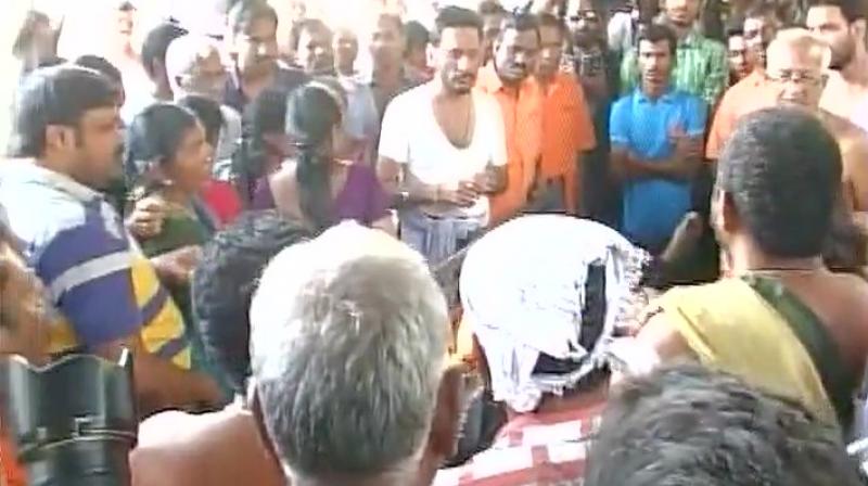 A steady stream of visitors thronged the house, offering garlands and placing a wreath on the mortal remains kept in a body freezer, before the last rites. (Photo: ANI Twitter) A steady stream of visitors thronged the house, offering garlands and placing a wreath on the mortal remains kept in a body freezer, before the last rites. (Photo: ANI Twitter)