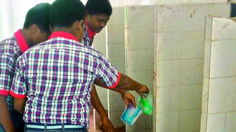 KV students cleaning toilets without precautionary measures such as gloves or masks. KV students cleaning toilets without precautionary measures such as gloves or masks.