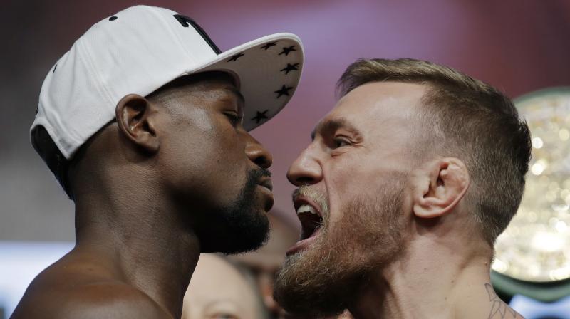 Floyd Mayweather and Conor McGregor prepared for their money-spinning showdown as Las Vegas crackled with anticipation for what is poised to become the richest fight in history. (Photo: AP) Floyd Mayweather and Conor McGregor prepared for their money-spinning showdown as Las Vegas crackled with anticipation for what is poised to become the richest fight in history. (Photo: AP)