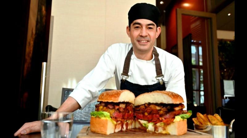 Chef Patrick Shimada's giant burger to celebrate the new emperor weighs three kilograms (six pounds) and costs USD 900. (Photo: AFP) Chef Patrick Shimada's giant burger to celebrate the new emperor weighs three kilograms (six pounds) and costs USD 900. (Photo: AFP)