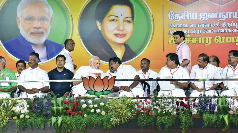 Prime Minster Narendra Modi interacts with Chief Minister Edappadi K. Palaniswami at the elelction rally in Coimbatore on Tuesday. (Photo: B. Vignesh) Prime Minster Narendra Modi interacts with Chief Minister Edappadi K. Palaniswami at the elelction rally in Coimbatore on Tuesday. (Photo: B. Vignesh)
