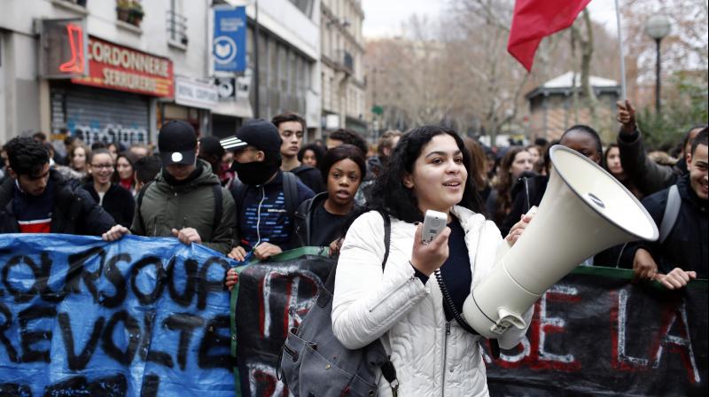 Shouts of 'Macron, resign' mingled with the tear gas near the famous Champs-Elysees avenue, the scene last Saturday of the worst rioting in Paris for decades. (Photo: AP) Shouts of 'Macron, resign' mingled with the tear gas near the famous Champs-Elysees avenue, the scene last Saturday of the worst rioting in Paris for decades. (Photo: AP)