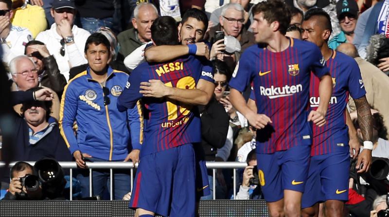 Luis Suarez struck in the 54th minute of the politically charged game and Messi added a penalty 10 minutes later after Madrid's Dani Carvajal received a direct red for stopping a goal-bound header by Paulinho.(Photo: AP) Luis Suarez struck in the 54th minute of the politically charged game and Messi added a penalty 10 minutes later after Madrid's Dani Carvajal received a direct red for stopping a goal-bound header by Paulinho.(Photo: AP)