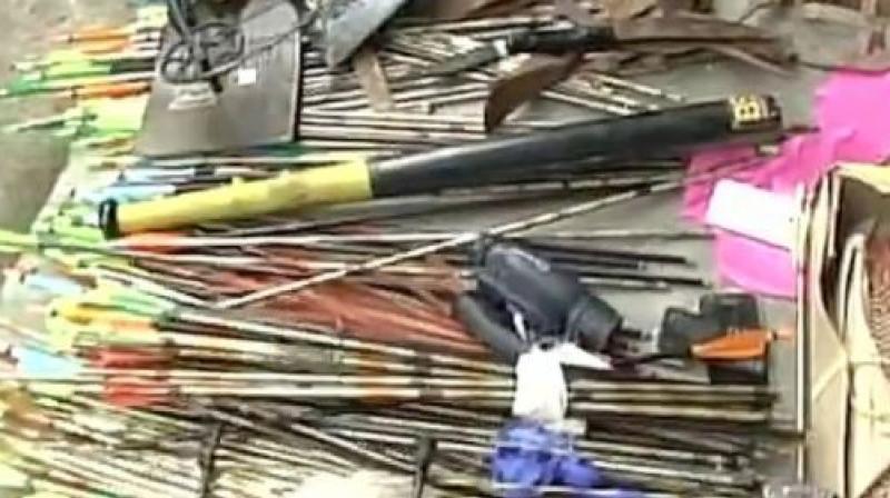 Police recover weapons during raid at Gorkha Janmukti Morcha office. (Photo: ANI | Twitter) Police recover weapons during raid at Gorkha Janmukti Morcha office. (Photo: ANI | Twitter)