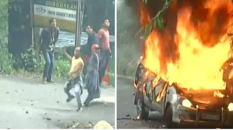 GJM leaders and supporters pelt stones at police, set a car on fire in protest. (Photo: ANI | Twitter) GJM leaders and supporters pelt stones at police, set a car on fire in protest. (Photo: ANI | Twitter)