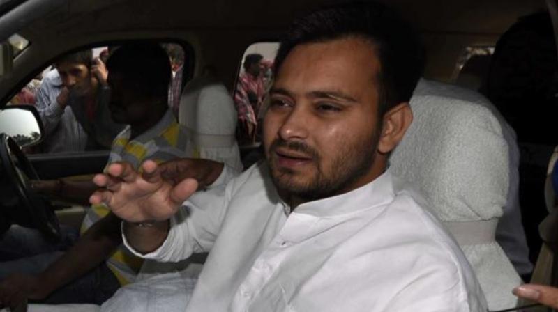 Meanwhile, in his bid to put rest to all speculations regarding alleged 'tension' between him and his elder brother over the distribution of party tickets, Tejashwi went on to meet Tej Pratap Yadav to wish him on his birthday. (Photo: PTI) Meanwhile, in his bid to put rest to all speculations regarding alleged 'tension' between him and his elder brother over the distribution of party tickets, Tejashwi went on to meet Tej Pratap Yadav to wish him on his birthday. (Photo: PTI)