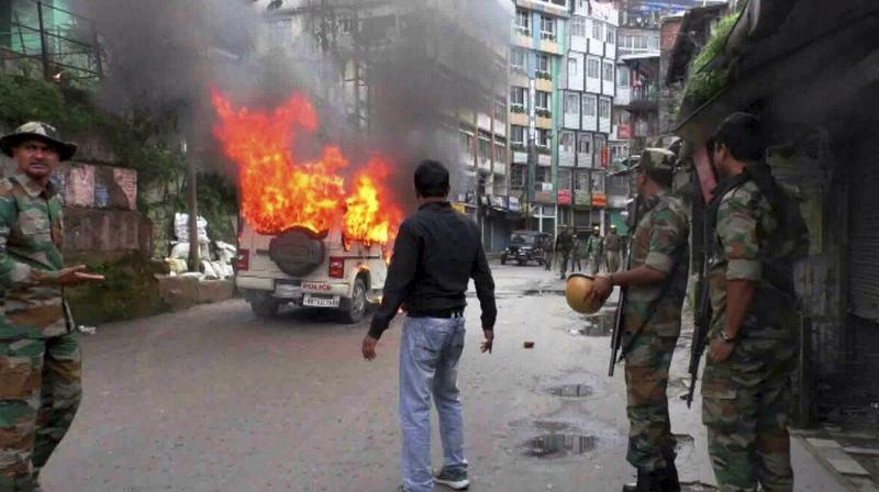 A vehicle in flames after it was set on fire by the protesters in Darjeeling on Wednesday. (Photo: PTI) A vehicle in flames after it was set on fire by the protesters in Darjeeling on Wednesday. (Photo: PTI)