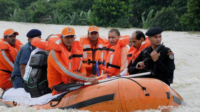 Uttar Pradesh Chief Minister Yogi Adityanath inspects flood-affected areas in Gorakhpur. (Photo: PTI) Uttar Pradesh Chief Minister Yogi Adityanath inspects flood-affected areas in Gorakhpur. (Photo: PTI)