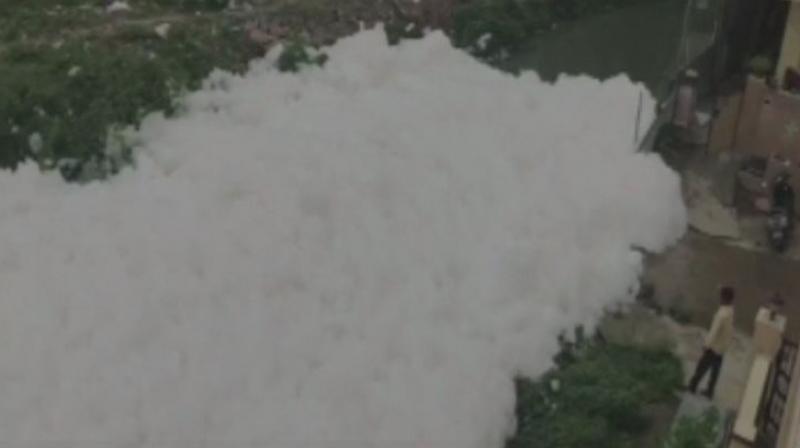 The reason behind the foam is the toxic wastes released into the drain and can be seen spilling on to the streets. (Photo: ANI | Twitter) The reason behind the foam is the toxic wastes released into the drain and can be seen spilling on to the streets. (Photo: ANI | Twitter)