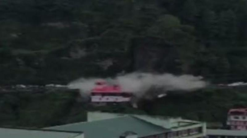 Traffic movement was affected after a massive landslide at Chandigarh-Shimla National Highway. (Photo: Screengrab | ANI) Traffic movement was affected after a massive landslide at Chandigarh-Shimla National Highway. (Photo: Screengrab | ANI)