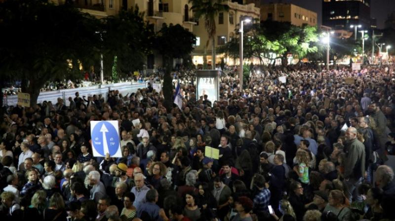 Israelis take part in a demonstration under the name "March of Shame" to protest against government corruption and Prime Minister Benjamin Netanyahu on December 2, 2017 in Tel Aviv (Photo: AFP/ File) Israelis take part in a demonstration under the name "March of Shame" to protest against government corruption and Prime Minister Benjamin Netanyahu on December 2, 2017 in Tel Aviv (Photo: AFP/ File)