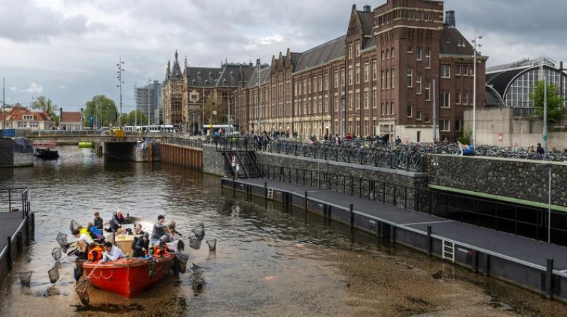 The Plastic Whale tours are part of a growing trend, with Amsterdam authorities separately launching a series of initiatives to direct tourists to alternative activities and ease the pressure on the top sites. (Photo: AFP) The Plastic Whale tours are part of a growing trend, with Amsterdam authorities separately launching a series of initiatives to direct tourists to alternative activities and ease the pressure on the top sites. (Photo: AFP)