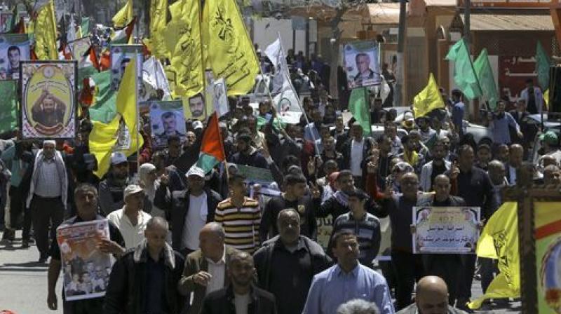 Palestinian officials said some 1,500 inmates affiliated with all political factions including rival Fatah and Hamas were taking part in the protest. (Photo: AP) Palestinian officials said some 1,500 inmates affiliated with all political factions including rival Fatah and Hamas were taking part in the protest. (Photo: AP)