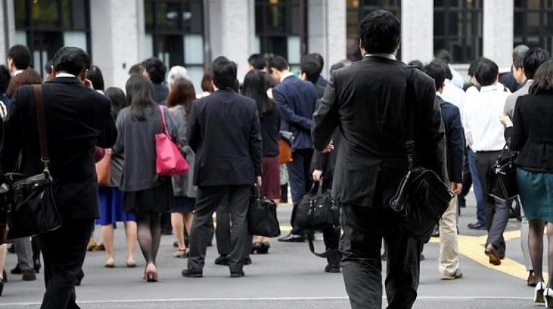 Major firms including automakers Nissan and Toyota, beverage giant Suntory and brokerage Nomura are taking part in the government-backed initiative. (Photo: AFP) Major firms including automakers Nissan and Toyota, beverage giant Suntory and brokerage Nomura are taking part in the government-backed initiative. (Photo: AFP)