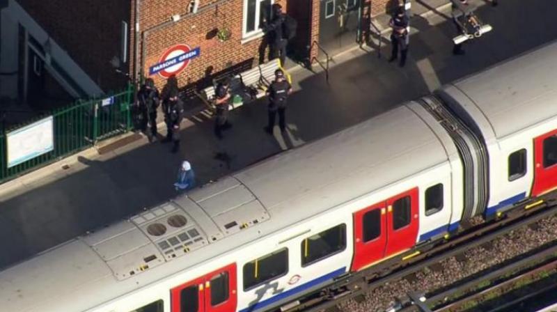 In this aerial image made from video, police officers work at the Parsons Green Underground station after an explosion in London on Friday. (Photo: AP) In this aerial image made from video, police officers work at the Parsons Green Underground station after an explosion in London on Friday. (Photo: AP)