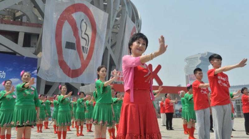 As China considers a nationwide ban on smoking in public places, the fight is well underway in Beijing, which banned smoking in restaurants and other indoor areas 18 months ago. (Photo: Representational Image/AFP) As China considers a nationwide ban on smoking in public places, the fight is well underway in Beijing, which banned smoking in restaurants and other indoor areas 18 months ago. (Photo: Representational Image/AFP)
