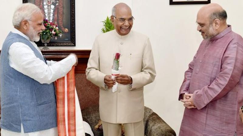 Prime Minister Narendra Modi and BJP President Amit Shah greet Ram Nath Kovind on being elected as the 14th President of India. (Photo: PTI) Prime Minister Narendra Modi and BJP President Amit Shah greet Ram Nath Kovind on being elected as the 14th President of India. (Photo: PTI)