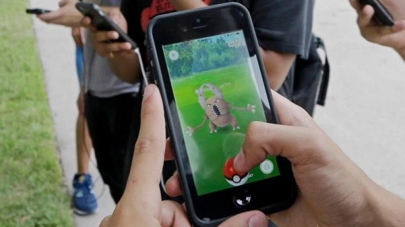 The driver was apparently waiting on the side of the road to catch a Rayquaza that is hard to find in the augmented reality game. The driver was apparently waiting on the side of the road to catch a Rayquaza that is hard to find in the augmented reality game.