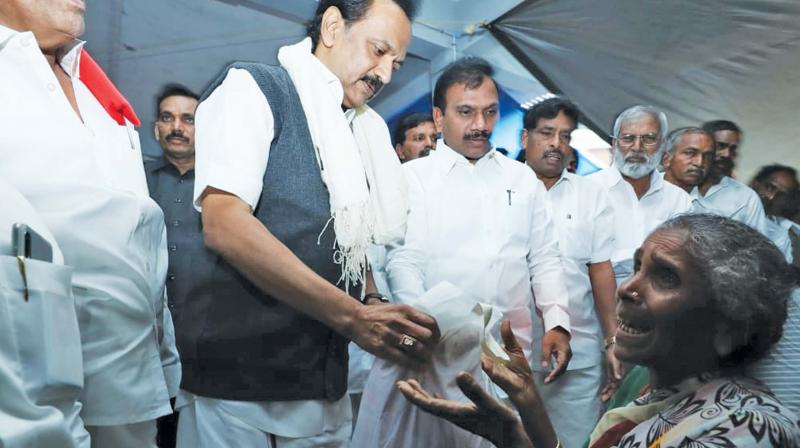 M.K.Stalin, DMK President, consoles the flood affected families at Naduvattam near Gudalur in Nilgiris. M.K.Stalin, DMK President, consoles the flood affected families at Naduvattam near Gudalur in Nilgiris.