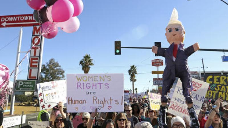 People participate in a women's march to protest newly inaugurated President Donald Trump in Las Vegas. (Photo: AP) People participate in a women's march to protest newly inaugurated President Donald Trump in Las Vegas. (Photo: AP)