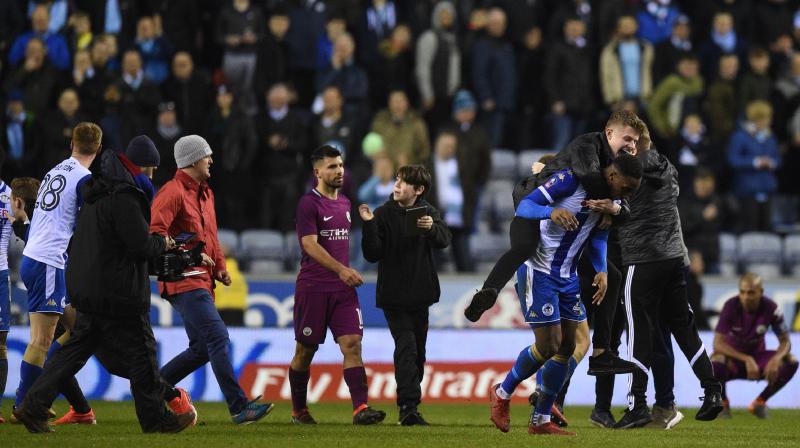 Wigan earlier on Tuesday announced a full investigation into the crowd disturbances that marred the club's dramatic victory which came courtesy of a 79th-minute strike from Will Grigg, ending City's quest for a historic quadruple. (Photo: AFP) Wigan earlier on Tuesday announced a full investigation into the crowd disturbances that marred the club's dramatic victory which came courtesy of a 79th-minute strike from Will Grigg, ending City's quest for a historic quadruple. (Photo: AFP)