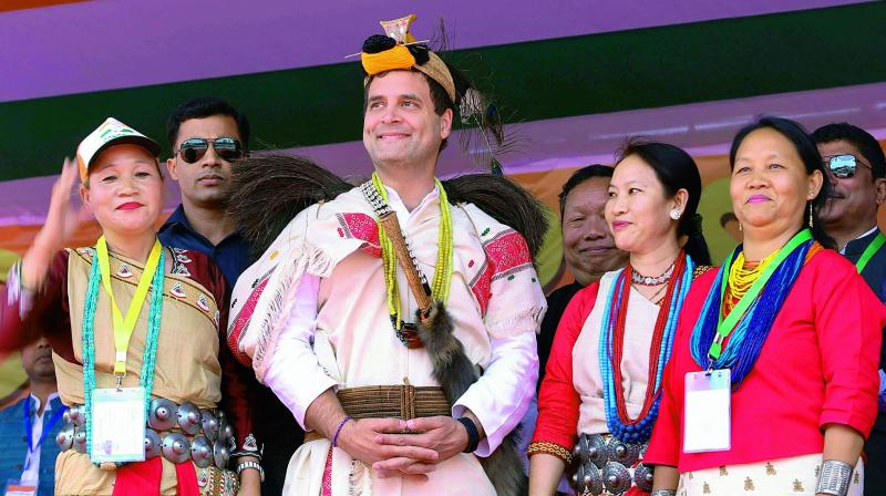 Congress chief Rahul Gandhi with party supporters during a public meeting in Itanagar on Tuesday. (Photo: PTI) Congress chief Rahul Gandhi with party supporters during a public meeting in Itanagar on Tuesday. (Photo: PTI)