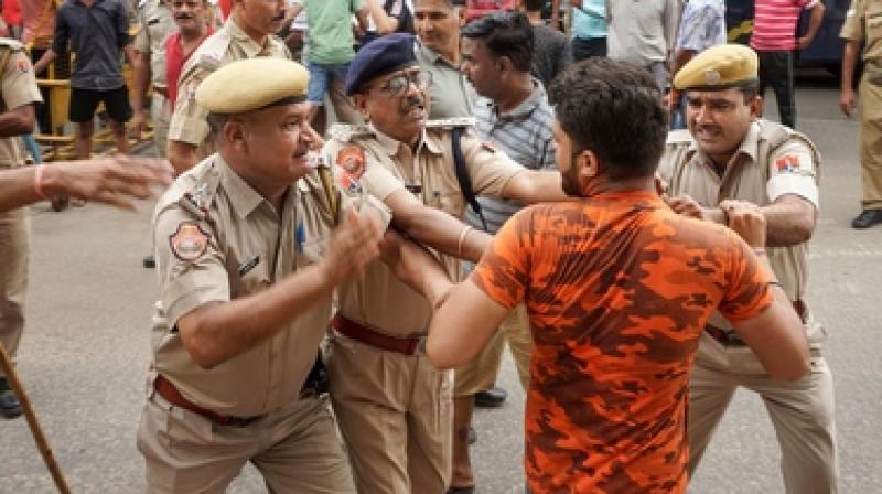 A mob also damaged windowpanes of some cars parked in the streets. (Photo: PTI) A mob also damaged windowpanes of some cars parked in the streets. (Photo: PTI)
