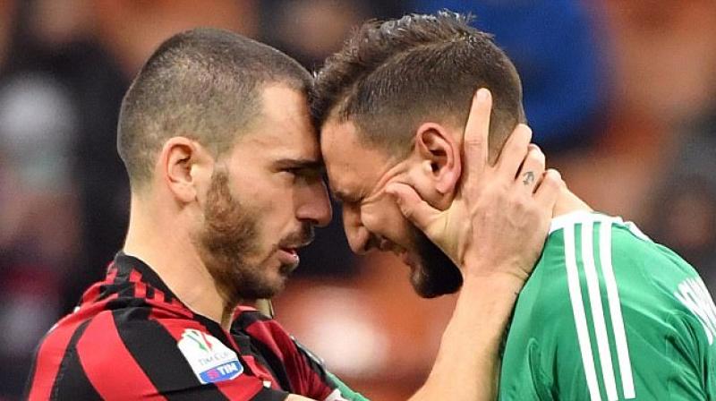 Gianluigi Donnarumma was in tears as he was comforted by teammate Leonardo Bonucci(Photo: AP) Gianluigi Donnarumma was in tears as he was comforted by teammate Leonardo Bonucci(Photo: AP)