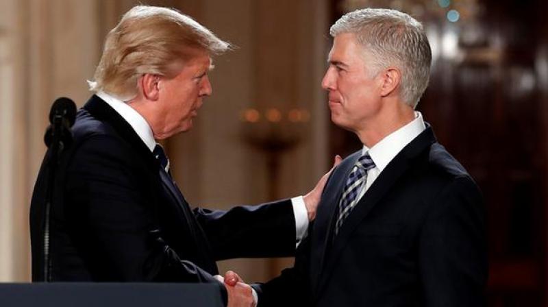 President Donald Trump shakes hands with 10th US Circuit Court of Appeals Judge Neil Gorsuch, his choice for Supreme Court Justices in the East Room of the White House. (Photo: AP) President Donald Trump shakes hands with 10th US Circuit Court of Appeals Judge Neil Gorsuch, his choice for Supreme Court Justices in the East Room of the White House. (Photo: AP)