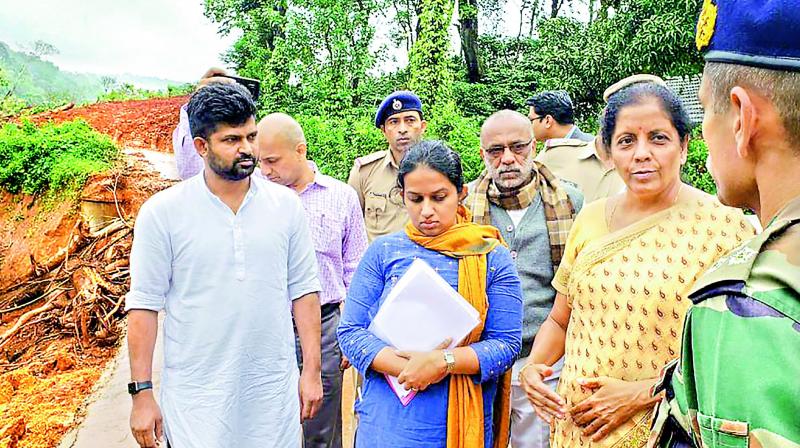 Defence minister Nirmala Sitharaman reviews the situations in flood-affected areas, in Kodagu on Friday. (Photo: PTI) Defence minister Nirmala Sitharaman reviews the situations in flood-affected areas, in Kodagu on Friday. (Photo: PTI)