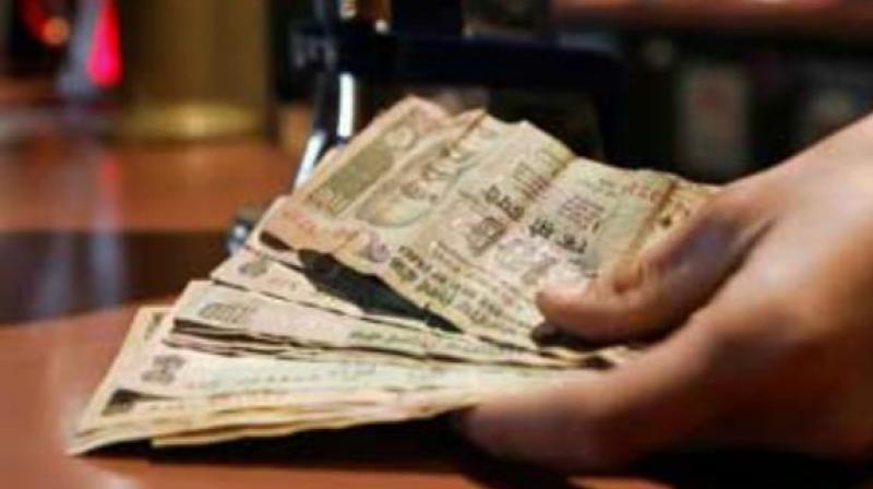 According to a study conducted by Mr P.K. Elumalai, Mr E. David and Mr Hemachandran on “bacterial contamination of Indian currency notes”, it has been found that the circulation of paper currency from one individual to another spreads microorganisms. (Representational image) According to a study conducted by Mr P.K. Elumalai, Mr E. David and Mr Hemachandran on “bacterial contamination of Indian currency notes”, it has been found that the circulation of paper currency from one individual to another spreads microorganisms. (Representational image)