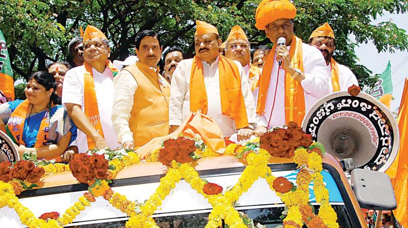 BJP candidate for Dharwad Lok Sabha constituency Pralhad Joshi comes in a procession to file his nomination papers in Dharwad on Wednesday. Former CM Jagadish Shettar, Basavaraj Bommai and others are seen. —KPN BJP candidate for Dharwad Lok Sabha constituency Pralhad Joshi comes in a procession to file his nomination papers in Dharwad on Wednesday. Former CM Jagadish Shettar, Basavaraj Bommai and others are seen. —KPN