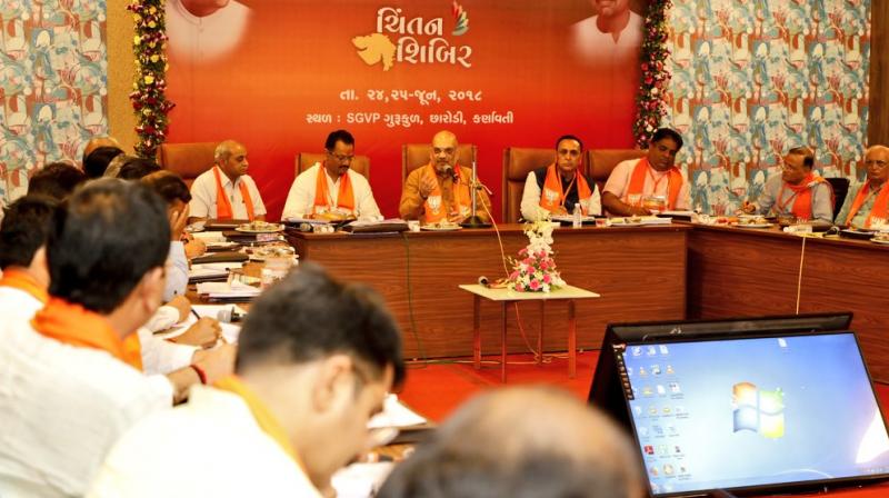 During the party's brainstorming session, BJP chief Amit Shah asked the party leaders to make people aware of the 'good work' done by the governments led by Narendra Modi at the Centre and Chief Minister Vijay Rupani in Gujarat, party sources said. (Photo: Twitter/@AmitShah) During the party's brainstorming session, BJP chief Amit Shah asked the party leaders to make people aware of the 'good work' done by the governments led by Narendra Modi at the Centre and Chief Minister Vijay Rupani in Gujarat, party sources said. (Photo: Twitter/@AmitShah)