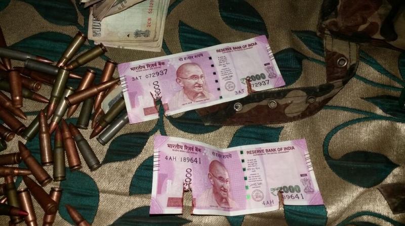 Bullets and notes recovered from the slain militants. (Photo: ANI/Twitter) Bullets and notes recovered from the slain militants. (Photo: ANI/Twitter)