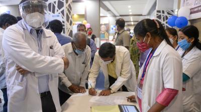 Medical workers wait to be inoculated with a Covid-19 vaccine at the King Koti hospital in Hyderabad on January 16, 2021. (Noah SEELAM / AFP)
