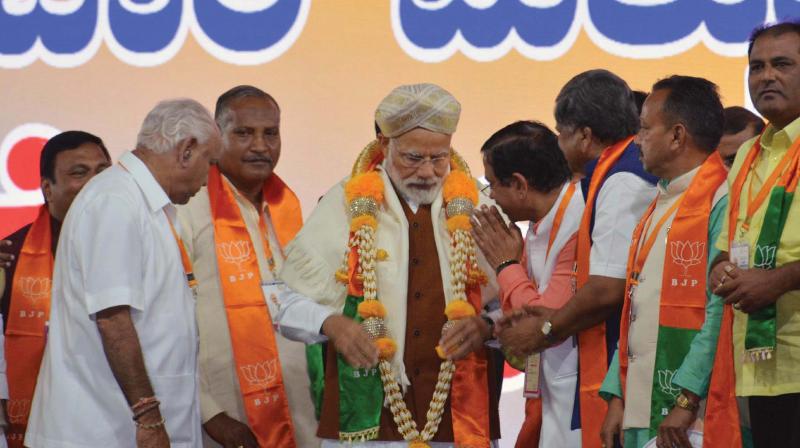 Prime Minister Narendra Modi with state BJP leaders at a party rally in Hubballi on Sunday (Photo: KPN( Prime Minister Narendra Modi with state BJP leaders at a party rally in Hubballi on Sunday (Photo: KPN(