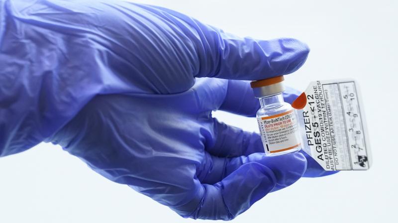 An RN holds a vial with the Pfizer-BioNTech COVID-19 vaccine for children five to 12 years. (Photo: AP)