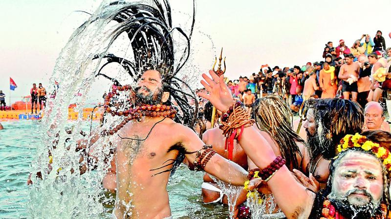 Devotees taking a dip into the holy water during the ongoing Kumbh Mela. Devotees taking a dip into the holy water during the ongoing Kumbh Mela.