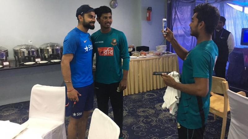 Bangladeshi youngsters took selfies with Virat Kohli after the Hyderabad Test. (Photo: BCCI) Bangladeshi youngsters took selfies with Virat Kohli after the Hyderabad Test. (Photo: BCCI)