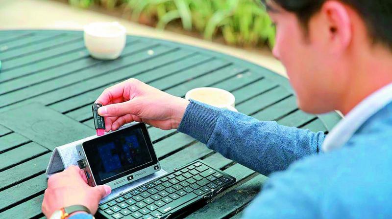 It claims to be the first truly pocketable PC, with a 5-inch LCD screen, 128GB of solid state storage 8GB RAM and running on an Intel Celeron processor. It claims to be the first truly pocketable PC, with a 5-inch LCD screen, 128GB of solid state storage 8GB RAM and running on an Intel Celeron processor.