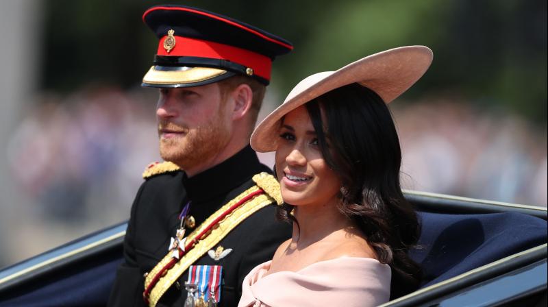 Britain's Prince Harry, Duke of Sussex and Britain's Meghan, Duchess of Sussex return in a horse-drawn carriage after attending the Queen's Birthday Parade, 'Trooping the Colour' on Horseguards parade in London on June 9, 2018. (Photo: AFP) Britain's Prince Harry, Duke of Sussex and Britain's Meghan, Duchess of Sussex return in a horse-drawn carriage after attending the Queen's Birthday Parade, 'Trooping the Colour' on Horseguards parade in London on June 9, 2018. (Photo: AFP)
