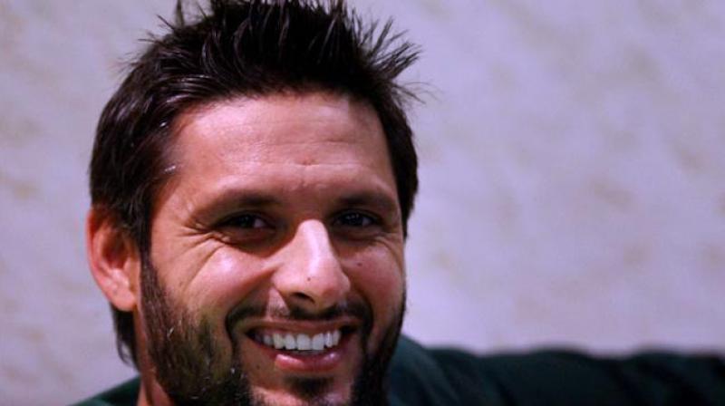 Shahid Afridi asked a group of Indian fans to hold the Indian flag properly and the video of the same has gone viral and the Indian Twitter users have loved Afridiโs gesture. (Photo: PTI) Shahid Afridi asked a group of Indian fans to hold the Indian flag properly and the video of the same has gone viral and the Indian Twitter users have loved Afridiโs gesture. (Photo: PTI)