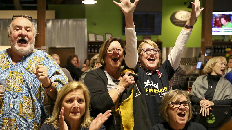 Voters react as they watch the results slowly trickle in on Wednesday. (Photo: AP) Voters react as they watch the results slowly trickle in on Wednesday. (Photo: AP)
