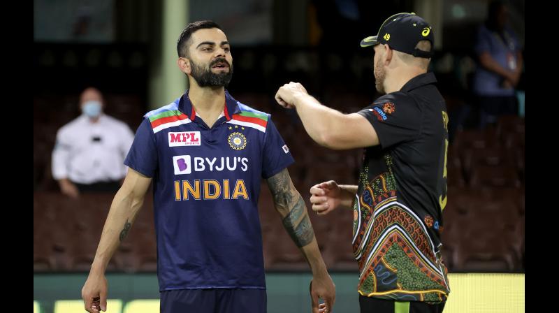 A file photo of India captain Virat Kohli (left) and Australia’s Aaron Finch. — AFP A file photo of India captain Virat Kohli (left) and Australia’s Aaron Finch. — AFP