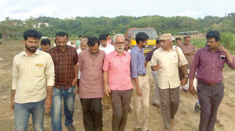 Environmentalist C.R. Neelakantan along with other members visit the sites where lake reclamation is happening at Akkulam in Thiruvananthapuram on Sunday Environmentalist C.R. Neelakantan along with other members visit the sites where lake reclamation is happening at Akkulam in Thiruvananthapuram on Sunday