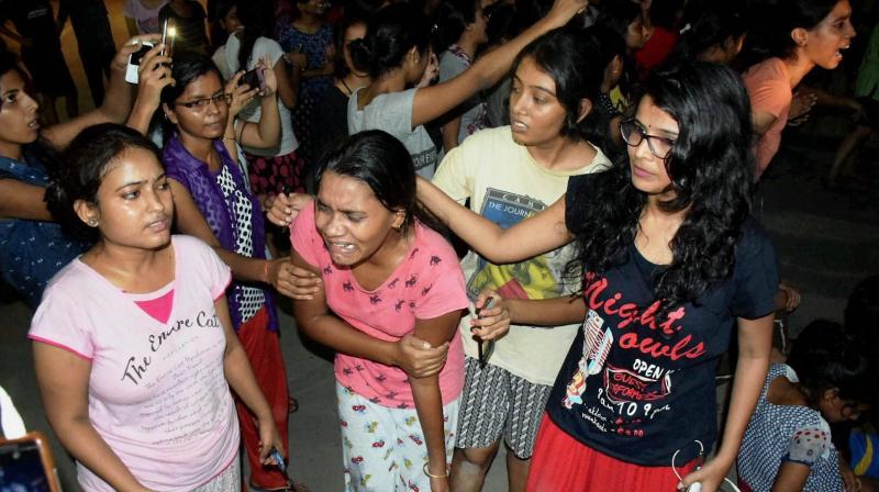 An injured student writhing in pain after police allegedly beat them up during a clash at Banaras Hindu University late Saturday night. (Photo: PTI) An injured student writhing in pain after police allegedly beat them up during a clash at Banaras Hindu University late Saturday night. (Photo: PTI)