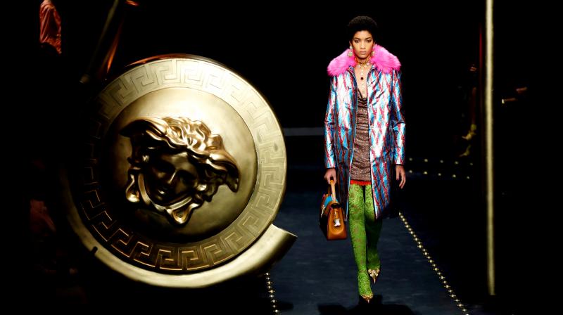 Greek mythology inspired Medusa-head safety pin, synonymous of brand Versace, was omnipresent on the runway. (Photo: AP) Greek mythology inspired Medusa-head safety pin, synonymous of brand Versace, was omnipresent on the runway. (Photo: AP)