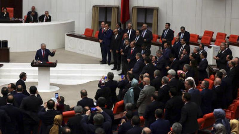 Turkey's parliament approved a contentious constitutional reform package, paving the way for a referendum on a presidential system that would greatly expand the powers of President Recep Tayyip Erdogan's office. (Photo: AP) Turkey's parliament approved a contentious constitutional reform package, paving the way for a referendum on a presidential system that would greatly expand the powers of President Recep Tayyip Erdogan's office. (Photo: AP)
