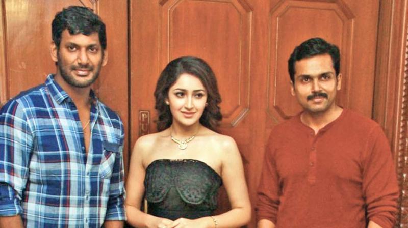 Vishal, Sayyeshaa and Karthi. Vishal, Sayyeshaa and Karthi.